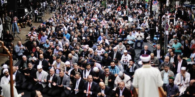 Muslims protest against the terror of the Islamic State militants after the Friday pray in Berlin, Germany, Friday, Sept. 19, 2014. The Central Council of Muslims in Germany called for rallies against the terror in nine German cites. (AP Photo/Markus Schreiber)