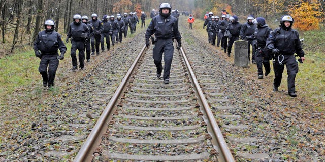 Nov. 7, 2011: Police officers secure the rails near Leitstade, Germany, prior to a nuclear waste transport passing through the area. German police are preparing a big security operation to protect a shipment of nuclear waste being moved to storage site next week, as protests are expected despite a decision to speed up the country's exit from nuclear energy.