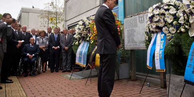 Israel's deputy Prime Minister Silvan Shalom, right, stands in front of wreaths at a memorial at the former accommodation building of the Israeli Olympic team in Munich, southern Germany, Wednesday, Sept. 5, 2012, during a commemoration ceremony for the assassination victims of the Olympic games in Munich in 1972. 17 people died in a failed liberation attempt of Israeli hostages, eleven of them of Israel's Olympic team, five terrorists and a German police officer. (AP Photo/dapd, Joerg Koch)