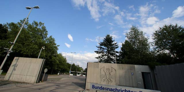 FILE - This Aug. 13, 2013 file picture shows the entrance of the Bundesnachrichtendienst ,BND, in Pullach, Germany. Prosecutors have charged a German spy with treason, breach of official secrecy and taking bribes for allegedly providing secret documents to both the CIA and Russia's intelligence agency. Prosecutors say Thursday Aug. 20, 2015, the 32-year-old man,handled mail and classified documents for Germany's foreign intelligence agency BND. ( Stephan Jansen/dpa via AP)