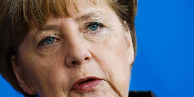 German Chancellor Angela Merkel attends a news conference with the Prime Minister of Sweden Stefan Lofven after a meeting at the chancellery in Berlin, Germany, Wednesday, Feb. 25, 2015. (AP Photo/Markus Schreiber)