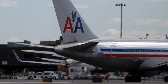 NEW YORK, NY - APRIL 27: An American Airlines plane is seen at John F. Kennedy International Airport April 27, 2012 in the Queens borough of New York City.  (Photo by Allison Joyce/Getty Images)