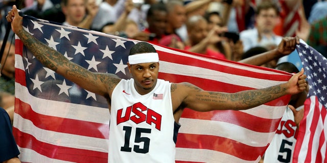 LONDON, ENGLAND - AUGUST 12: Carmelo Anthony #15 of the United States celebrates winning the Men's Basketball gold medal game between the United States and Spain on Day 16 of the London 2012 Olympics Games at North Greenwich Arena on August 12, 2012 in London, England. The United States won the match 107-100.  (Photo by Christian Petersen/Getty Images)