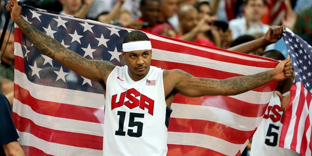 LONDON, ENGLAND - AUGUST 12: Carmelo Anthony #15 of the United States celebrates winning the Men's Basketball gold medal game between the United States and Spain on Day 16 of the London 2012 Olympics Games at North Greenwich Arena on August 12, 2012 in London, England. The United States won the match 107-100. (Photo by Christian Petersen/Getty Images)