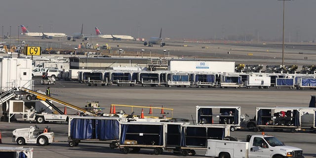 SALT LAKE CITY, UT - NOVEMBER 27: Delta planes stack up for take-off and are proceed through the Salt Lake City international Airport on November 27, 2013 in Salt Lake City, Utah. A wintry storm system that is covering much of the nation is threatening to wreak havoc on holiday travel . (Photo by George Frey/Getty Images)