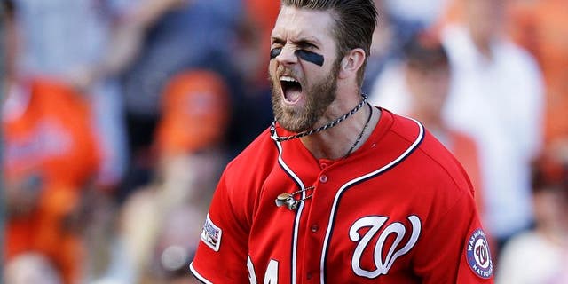 SAN FRANCISCO, CA - OCTOBER 06: Bryce Harper #34 of the Washington Nationals celebrates after scoring on a throwing error by Madison Bumgarner #40 of the San Francisco Giants in the seventh inning during Game Three of the National League Division Series at AT&T Park on October 6, 2014 in San Francisco, California. (Photo by Ezra Shaw/Getty Images)