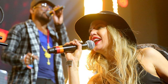 INDIO, CA - APRIL 12: Recording artists will.i.am (L) and Fergie of The Black Eyed Peas perform onstage with David Guetta during day 3 of the 2015 Coachella Valley Music & Arts Festival (Weekend 1) at the Empire Polo Club on April 12, 2015 in Indio, California. (Photo by Mark Davis/Getty Images for Coachella)