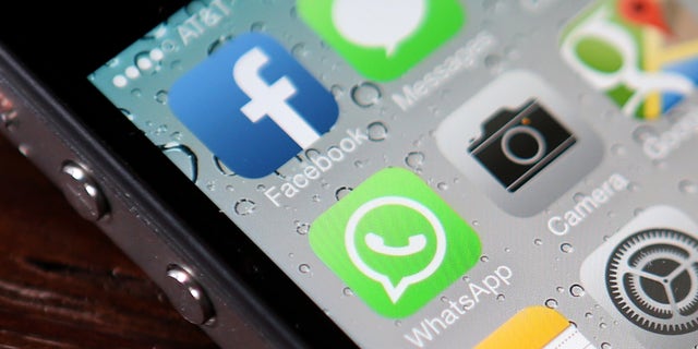 SAN FRANCISCO, CA - FEBRUARY 19: The Facebook and WhatsApp app icons are displayed on an iPhone on February 19, 2014 in San Francisco City. Facebook Inc. announced that it will purchase smartphone-messaging app company WhatsApp Inc. for $19 billion in cash and stock. (Photo illustration by Justin Sullivan/Getty Images)