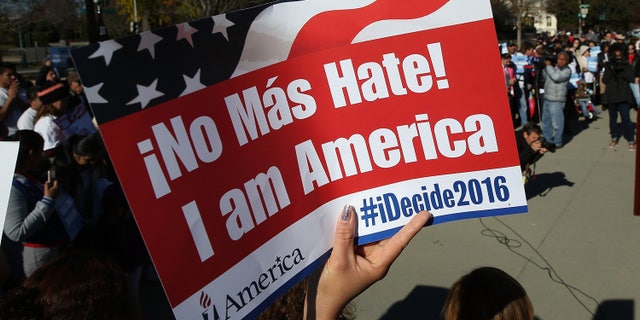 WASHINGTON, DC - NOVEMBER 20: Supporters of immigration reform protest outside the U.S. Supreme Court November 20, 2015 in Washington, DC. The protesters demanded the implementation of U.S. President Barack Obama's immigration relief programs, including the Deferred Action for Parents of Americans and Lawful Permanent Residents and expanded Deferred Action for Childhood Arrivals, during the protest. (Photo by Win McNamee/Getty Images)