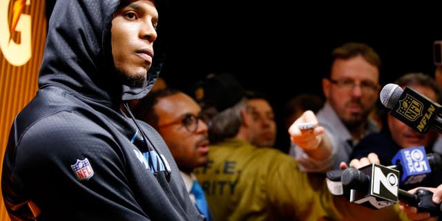 SANTA CLARA, CA - FEBRUARY 07: Cam Newton #1 of the Carolina Panthers reacts during his postgame press conference after the Denver Broncos defeated the Carolina Panthers with a score of 24 to 10 to win Super Bowl 50 at Levi's Stadium on February 7, 2016 in Santa Clara, California. (Photo by Kevin C. Cox/Getty Images)