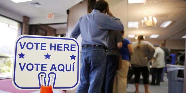 ROSENBERG, TEXAS - MARCH 1: Voters stand in line to cast their ballots inside Calvary Baptist Church March 1, 2016 in Rosenberg, Texas. Voters in 12 states go to the polls in today's Super Tuesday. (Photo by Erich Schlegel/Getty Images)
