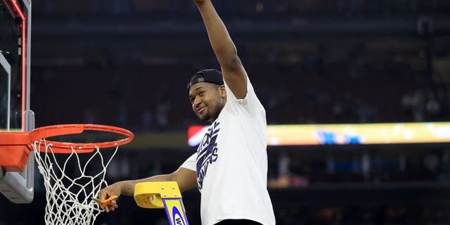 HOUSTON, TEXAS - APRIL 04: Kris Jenkins #2 of the Villanova Wildcats cuts the net after defeating the North Carolina Tar Heels 77-74 to win the 2016 NCAA Men's Final Four National Championship game at NRG Stadium on April 4, 2016 in Houston, Texas. (Photo by Ronald Martinez/Getty Images)