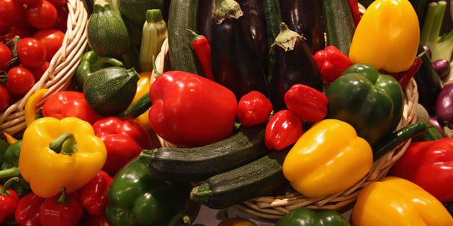 BERLIN - JANUARY 18: Different kinds of vegetables, including paprikas, zucchini and tomatoes, lie on display at a government stand that offers information on nutrition at the Gruene Woche agricultural trade fair January 18, 2008 in Berlin, Germany. The Gruene Woche runs from January 18 through 27. (Photo by Sean Gallup/Getty Images)