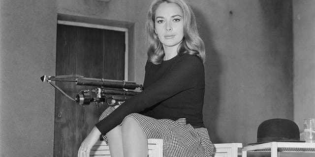 German actress Karin Dor holding a harpoon gun, 6th October 1966. She is starring in the James Bond film 'You Only Live Twice'. (Photo by Larry Ellis/Express/Hulton Archive/Getty Images)