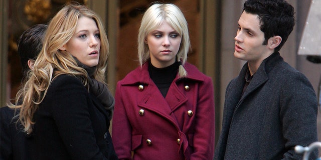 Penn Badgley (right) on the set of "Gossip Girl."