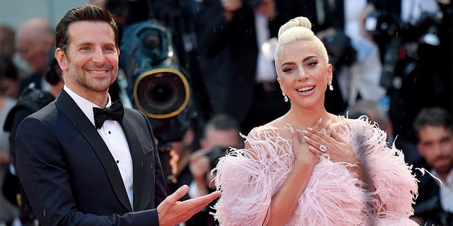 Bradley Cooper and Lady Gaga take turns sharing the spotlight at the 'A Star Is Born"' premiere during the Venice Film Festival.