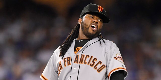 San Francisco Giants starting pitcher Johnny Cueto winces after injuring himself during the sixth inning of a baseball game against the Los Angeles Dodgers, Tuesday, Sept. 20, 2016, in Los Angeles. Cueto was taken out of the game soon after. (AP Photo/Mark J. Terrill)