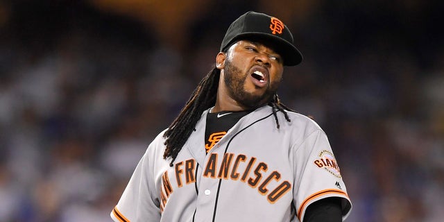 San Francisco Giants starting pitcher Johnny Cueto winces after injuring himself during the sixth inning of a baseball game against the Los Angeles Dodgers, Tuesday, Sept. 20, 2016, in Los Angeles. Cueto was taken out of the game soon after. (AP Photo/Mark J. Terrill)