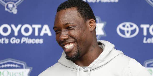 FILE - In this July 24, 2014, file photo, New York Giants' Jason Pierre-Paul talks to reporters during an NFL football camp in East Rutherford, N.J. Pierre-Paul has rapid-fire answers for just about anything he is asked, from the state of the New York Giants' defensive line to his own health to some missing teammates. (AP Photo/Seth Wenig, File)