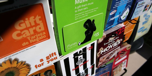SAN FRANCISCO - DECEMBER 19: Gift cards from various retailers are seen on display at a Chevron service station convenience store December 19, 2006 in San Francisco, California. According to the trade group National Retail Federation, holiday gift buyers will purchase an estimated $24.8 billion in gift cards, up 34 percent from last year. (Photo by Justin Sullivan/Getty Images)