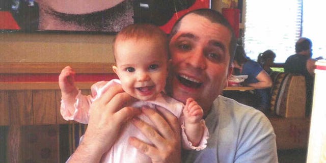 March 12, 2013: This undated file photo submitted into evidence by defense attorney Julia L. Gatto shows New York City police Officer Gilberto Valle with his daughter. Valle, accused of plotting to kidnap, cook and eat women _ including his wife _ was convicted of conspiracy.
