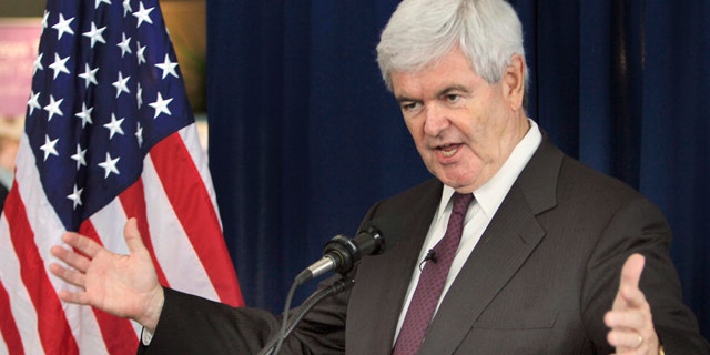 FILE - Republican presidential hopeful, former House Speaker Newt Gingrich gestures while speaking during a Town Hall style meeting at the Derry Medical Center in Derry, N.H., in this May 25, 2011 file photo. The entire top echelon of Newt Gingrich's presidential campaign resigned on Thursday, June 9, 2011 a stunning mass exodus that left his bid for the Republican nomination in tatters. But the former House speaker vowed defiantly to remain a candidate.