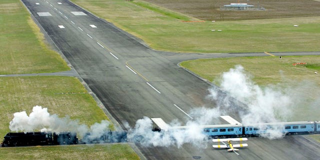 Steam Train At Airport.
