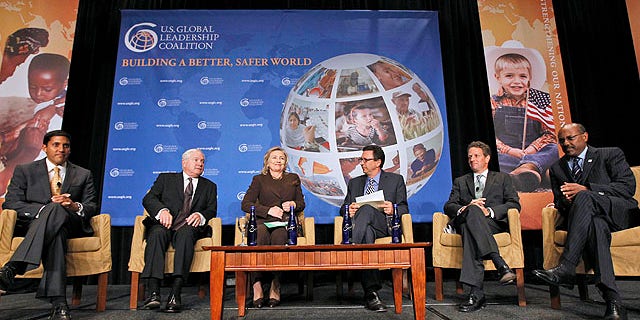 Sept. 28, 2010: From left, USAID Administrator Rajiv Shah, Defense Secretary Robert Gates, Secretary of State Hillary Rodham Clinton, moderator Frank Sesno director School of Media and Public Affairs, George Washington University, Treasury Secretary Timothy Geithner, and Millennium Challenge Corporation CEO Daniel Yohannes, take part in the U.S. Global Leadership Coalition roundtable discussion in Washington.
