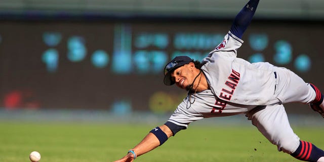 FILE - In this Oct. 1, 2016, file photo, Cleveland Indians shortstop Francisco Lindor dives for a ground ball hit by Kansas City Royals' Drew Butera during a baseball game at Kauffman Stadium in Kansas City, Mo. Lindor won a Gold Glove award, announced Tuesday, Nov. 8, by Rawlings. He is a first-time winner. (AP Photo/Orlin Wagner, File)