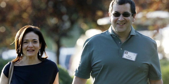 FILE - In this July 10, 2013 file photo, Sheryl Sandberg, COO of Facebook, left, and her husband David Goldberg, CEO of SurveyMonkey, walk to the morning session at the Allen & Company Sun Valley Conference in Sun Valley, Idaho. Goldberg was exercising at a gym in a Mexican resort when he collapsed before he died Friday, May 1, 2015, a person close to the family says. (AP Photo/Rick Bowmer, File)