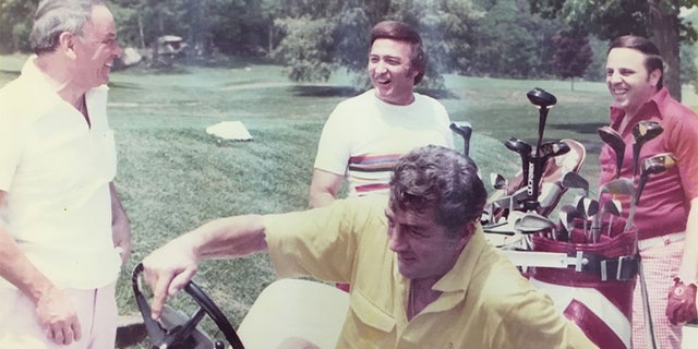 Frank Sinatra playing golf with Dean Martin and friends.