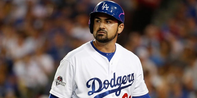 Adrian Gonzalez of the Los Angeles Dodgers reacts after striking out in the fifth inning against the New York Mets in game five of the National League Division Series at Dodger Stadium on October 15, 2015 in Los Angeles, California. (Photo by Sean M. Haffey/Getty Images)