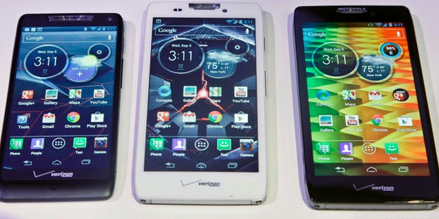 Sept. 5, 2012: Motorola's three new Droid Razr smartphones, the Droid Razr M, center, the Droid Razr HD, center, and the Droid Razr Maxx HD, are unveiled at a press conference. The phones are the first from Motorola as a part of Google.