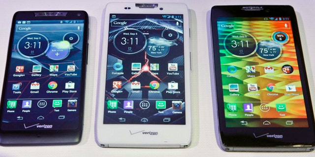 Sept. 5, 2012: Motorola's three new Droid Razr smartphones, the Droid Razr M, center, the Droid Razr HD, center, and the Droid Razr Maxx HD, are unveiled at a press conference. The phones are the first from Motorola as a part of Google.