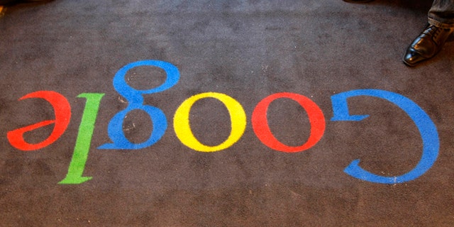 The Google logo is seen on the carpet at Google France offices, in Paris in this 2011 photo.