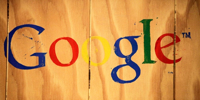 A Google logo is painted on the side of a plywood box at Google offices in New York.