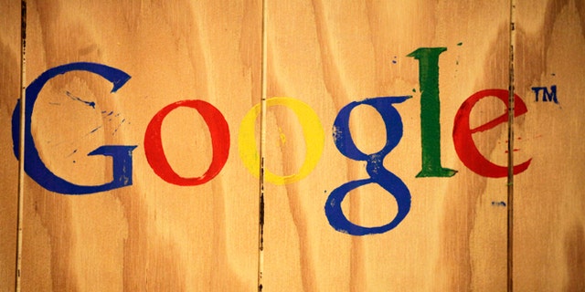 A Google logo is painted on the side of a plywood box at Google offices in New York.