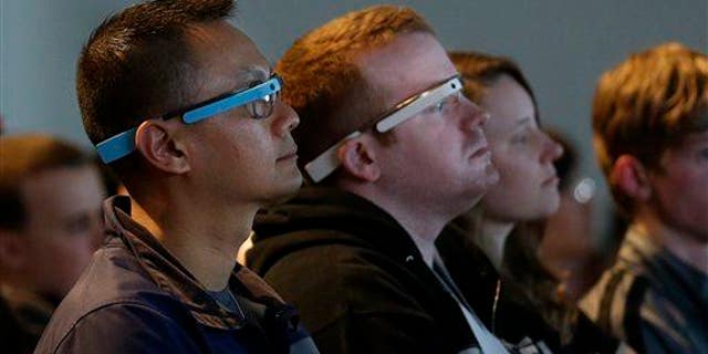 Attendees wear Google Glass during the Google I/O 2014 keynote presentation in San Francisco on June 25, 2014.
