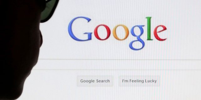 A computer user poses in front of a Google search page in this photo illustration taken in Brussels May 30, 2014. Google has taken the first steps to meet a European ruling that citizens can have objectionable links removed from Internet search results, a ruling that pleased privacy campaigners but raised fears that the right can be abused to hide negative information. REUTERS/Francois Lenoir (BELGIUM - Tags: POLITICS SCIENCE TECHNOLOGY) - RTR3RK9T