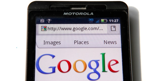 A Google homepage is displayed on a Motorola Droid phone in Washington August 15, 2011. Google Inc will buy phone hardware maker Motorola Mobility Holdings Inc for $12.5 billion to bolster adoption of its Android mobile software, and compete with smartphone rival Apple Inc. In its biggest deal to date, Google said it would pay $40 per share in cash, a 63 percent premium to Motorola Mobility's Friday closing price on the New York Stock Exchange.
REUTERS/Kevin Lamarque (UNITED STATES - Tags: SCI TECH BUSINESS) - RTR2PYXI
