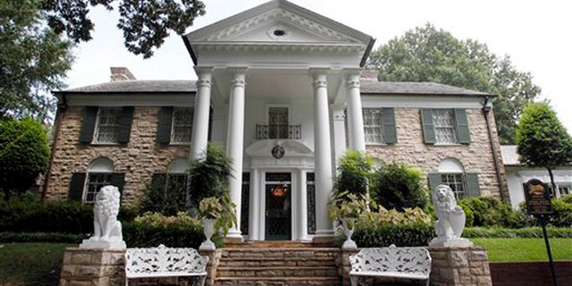 FILE -- This Aug. 2010 photo shows Graceland, Elvis Presley's home in Memphis, Tenn. Graceland opened for tours on June 7, 1982. They sold out all 3,024 tickets on the first day and didn't look back, forever changing the Memphis tourist landscape while keeping Elvis and his legend alive.(AP Photo/Mark Humphrey)