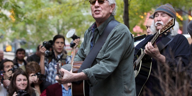 Musicians Graham Nash, second right, and David Crosby perform in Zuccotti Park where Occupy Wall Street campaign demonstrators have been occupying in New York November 8, 2011.