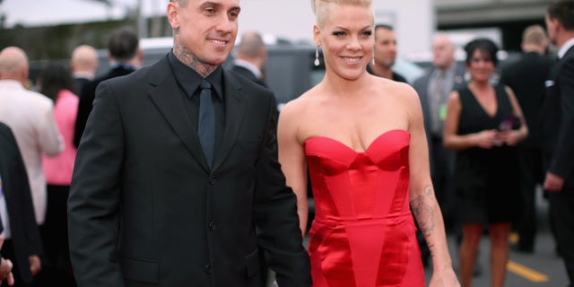 Carey Hart and singer Pink attend the 56th GRAMMY Awards at Staples Center