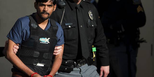 FILE- In this Nov. 28, 2012, file photo, Raghunandan Yandamuri is escorted from a Montgomery County district court after a preliminary hearing in Bridgeport, Pa. Yandamuri, who was sentenced to death in the killings of a baby and her grandmother in what prosecutors call a botched kidnapping plot, said Monday, April 13, 2015, that he's so dissatisfied with his attorneys he'd rather be executed now than continue seeking a new trial with them. (AP Photo/Matt Rourke, File)