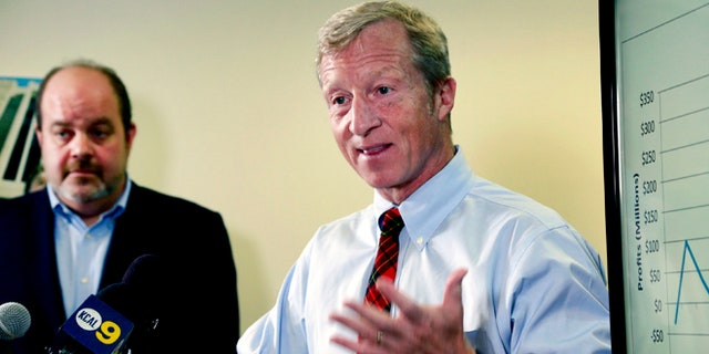 Billionaire climate activist Tom Steyer, right, speaks during a news conference with consumer advocate Jamie Court, left, president of Consumer Watchdog in Santa Monica, Calif.