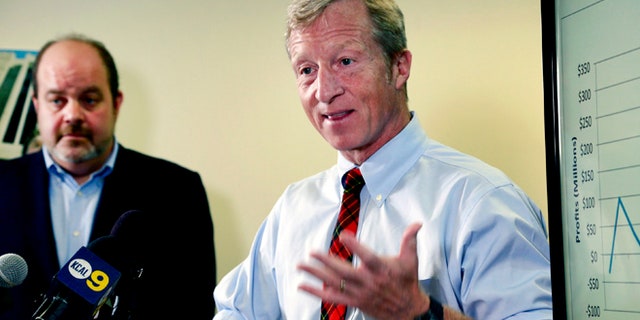 Billionaire climate activist Tom Steyer, right, speaks during a news conference with consumer advocate Jamie Court, left, president of Consumer Watchdog in Santa Monica, Calif.