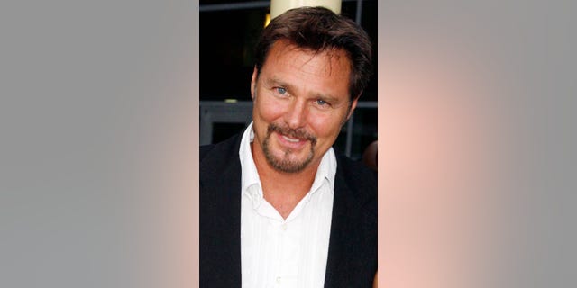 Actress Briana Evigan (R) poses with her father, actor Greg Evigan, as she arrives for the premiere of her new film "Sorority Row" in Hollywood, California September 3, 2009. REUTERS/Fred Prouser (UNITED STATES ENTERTAINMENT)