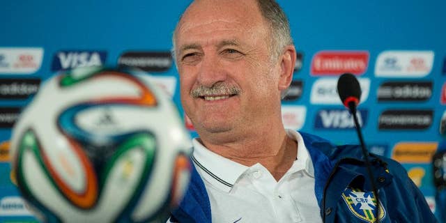 FILE - In this Friday, July 11, 2014 file photo, Brazil's coach Luiz Felipe Scolari smiles during a press conference a day before his team's World Cup third-place soccer match against the Netherlands at the Estadio Nacional in Brasilia, Brazil. Luiz Felipe Scolari, who resigned two weeks ago as Brazil coach, is returning to Gremio for his third stint in charge of the Brazilian team. The club confirmed the appointment on Tuesday July 29, 2014. Scolari first coached the club in 1987 and returned six years later for another stint. (AP Photo/Andre Penner, File)