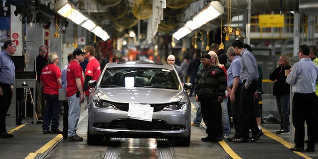 STERLING HEIGHTS, MI - MARCH 14: The new 2015 Chrysler 200 comes off the assembly line at the Sterling Heights Assembly Plant March 14, 2014 in Sterling Heights, Michigan. The plant, originally slated for closure in 2010, was transformed by an investment of more than $1 billion and is now one of the Chrysler Group's largest and most technologically advanced, with more than 5 million square feet of manufacturing space. (Photo by Bill Pugliano/Getty Images)