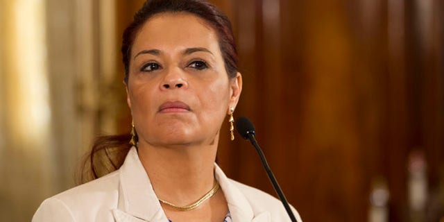 FILE - In this April 19, 2015 file photo, Guatemala's Vice President Roxana Baldetti listens to a question from journalists during a press conference at the presidential house in Guatemala City. President Otto Perez Molina announced Friday, May 8, 2015, that Baldetti will leave office. She is resigning amid a customs corruption scandal that has implicated her former private secretary. (AP Photo/Moises Castillo, File)